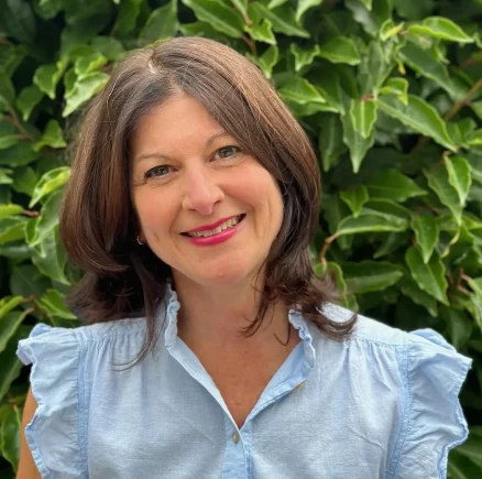 A professional portrait of Monique Daranyi, a psychotherapist, counsellor, and coach, exuding warmth and approachability.